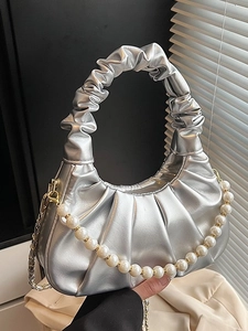 Silver pleated dumpling bag with pearl handle and metal chain shoulder strap for women