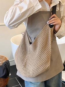 Large capacity woven tote bag in khaki with black leather straps for summer beach vacations
