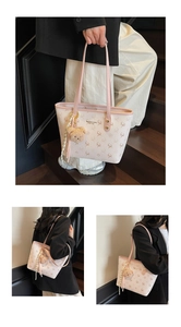 Detail of light pink tote bag with deer prints, bear charm, and decorative scarf