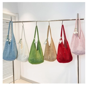 Detail of multi-color crochet tote bags with floral accents and hollow knit patterns