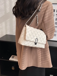 White quilted chain crossbody bag with black turn-lock and leather woven strap
