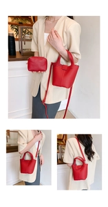 Detail of red lychee grain leather bucket bag set with matching zipper coin purse pouch