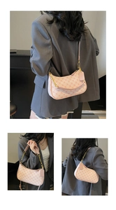 Detail showing pink and white monogram crescent bag with gold chain and leather strap