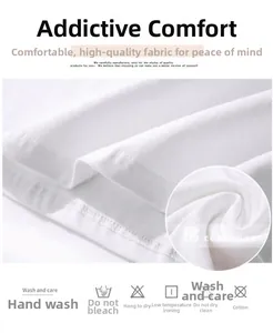 Detail of soft white cotton T-shirt fabric showing stitching and laundry care symbols