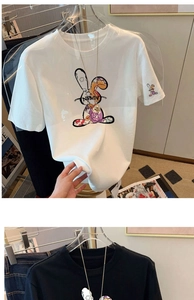 Detail shot of cotton T-shirt featuring a colorful rabbit graffiti print and NEMN embroidery