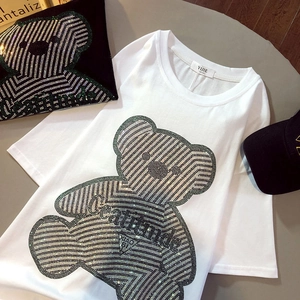 Detail of white cotton T-shirt featuring a luxury rhinestone bear and attitude lettering