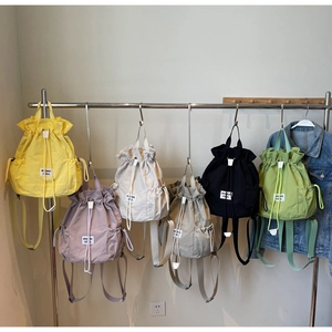 Detailed display of lightweight drawstring backpacks in six vibrant summer colors