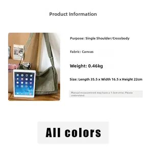 Detail view of large canvas messenger bag showing capacity with iPad size reference