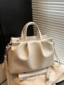 Cream pleated leather tote bag with lychee texture and adjustable shoulder strap