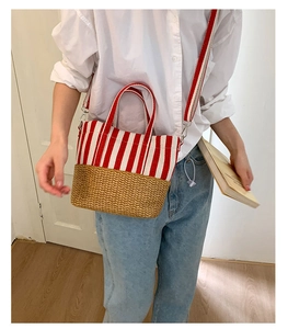 Detail of red stripe canvas and straw weave handbag with detachable shoulder strap