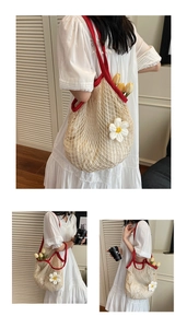 Detail of cotton mesh tote with red handles, inner lining, and crochet daisy flower