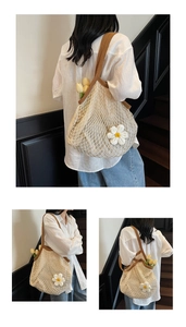 Detail of hand-woven cotton mesh bag with floral daisy decor and brown strap