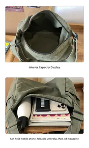 Detailed interior view showing large storage capacity of the green canvas messenger bag