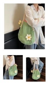 Detail of avocado green mesh tote bag with white daisy applique and pink trim handle