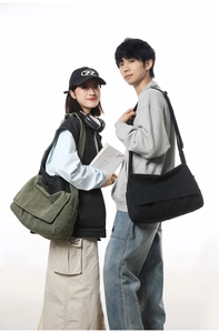 Dual-model view of large canvas messenger bags in black and forest green colors