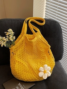 Bright yellow cotton mesh bag with white crochet daisy and inner lining for shopping