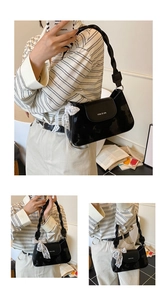 Detail of black patent leather underarm bag featuring a woven handle and lace bow accent