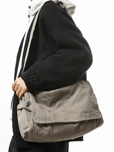 Large capacity canvas messenger bag in greyish-brown with flap cover and side pockets
