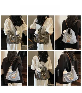 Detail shots of large hobo bag with jacquard patterns and decorative pearl chains