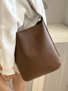 Minimalist vintage dark brown leather bucket bag with adjustable strap and large capacity