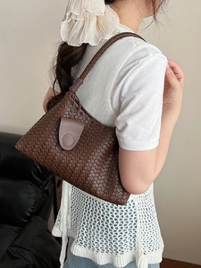 Brown woven leather shoulder bag with chic handmade texture and minimalist flap design