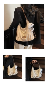 Detail of hobo bag featuring pearl chain accents and cloud plush charm detail