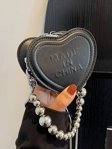 Black heart-shaped leather mini bag with embossed letters and silver metal bead chain