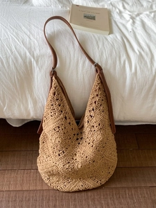 Oatmeal woven crochet hobo bag with adjustable brown leather strap for beach vacations