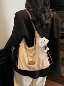 Chic beige canvas tote bag with pearl chain detail and cloud charm on shoulder