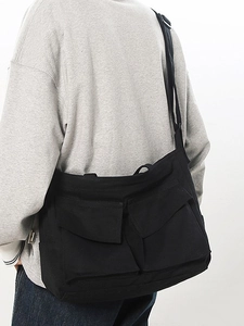 Sac messager rétro en toile noire avec plusieurs poches et bandoulière réglable pour le quotidien