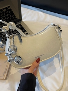 Chic pleated crescent underarm bag in cream beige with silver balloon dog charm