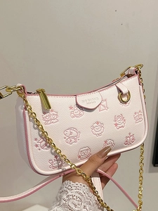 White faux leather bag with animal prints and golden chain strap in hand view