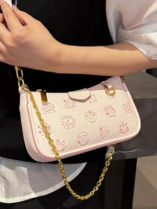 Pink underarm bag with gold chain strap featuring cute cartoon character prints