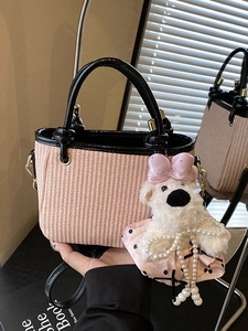 Pink woven handbag with black leather trim and cute plush bear charm for women