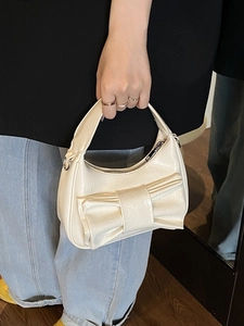 Chic creamy white bow bucket bag in wrinkled patent leather for women's crossbody use