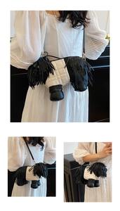 Detailed view of dog-shaped crossbody bag featuring white quilting and black tassels