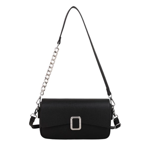 Black pebble leather crossbody bag with silver hardware and chain strap on white background