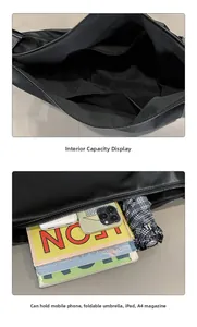 Large black tote bag interior showing spacious compartments and zip pockets for iPad