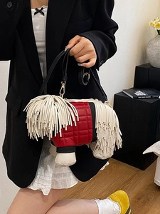 Creative sheepdog crossbody bag with white long tassels and red quilted body detail