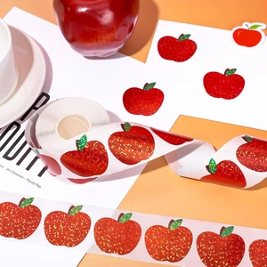 Roll of 500 red glitter apple laser stickers for sealing and decorative labeling