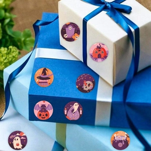 Detail of Halloween round stickers with ghosts and pumpkins on gift boxes