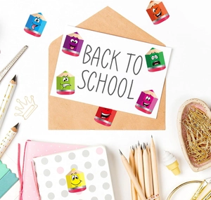 Close-up of colorful cartoon pencil stickers on school stationery and a greeting card