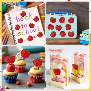 Sparkly red apple stickers shown as decorative seals on notebooks and gift packaging