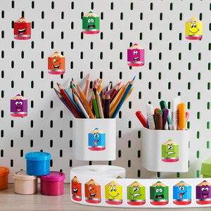 Detail of colorful cartoon pencil stickers with various expressions on a white pegboard