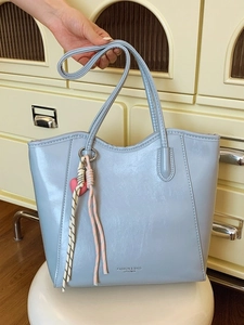 Light blue large capacity tote bag with long shoulder strap and heart charm for daily commute
