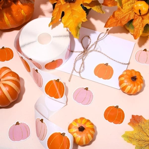 Macro view of pumpkin stickers roll with glossy finish for Halloween gift wrapping