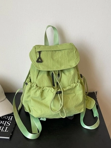 Light green drawstring nylon backpack with flap cover and large capacity for women