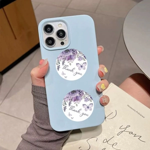 Detail showing decorative round floral thank you stickers applied on light blue phone case