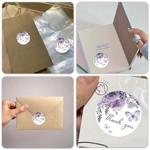 Roll of 500 floral Thank You stickers with purple butterflies for gift packaging seal