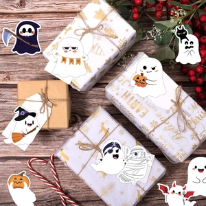 Detailed view of cartoon ghost stickers on a gift box with festive holiday decorations